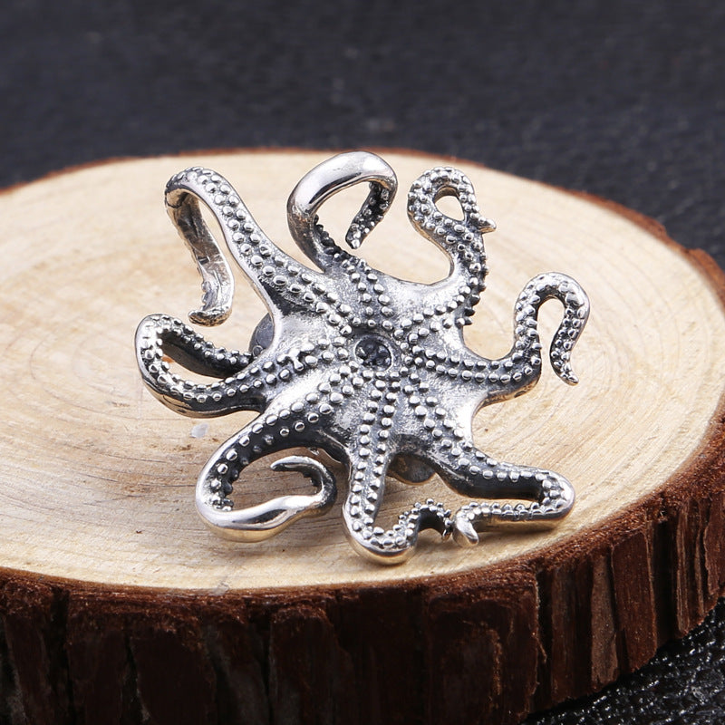 Back view of the pendant showing the detailed suckers along the tentacles and smooth rounded underside of the skull.