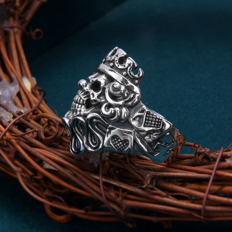 S925 Gothic skull king ring side profile on woven basket showing crown detail, roses and intricate scrollwork