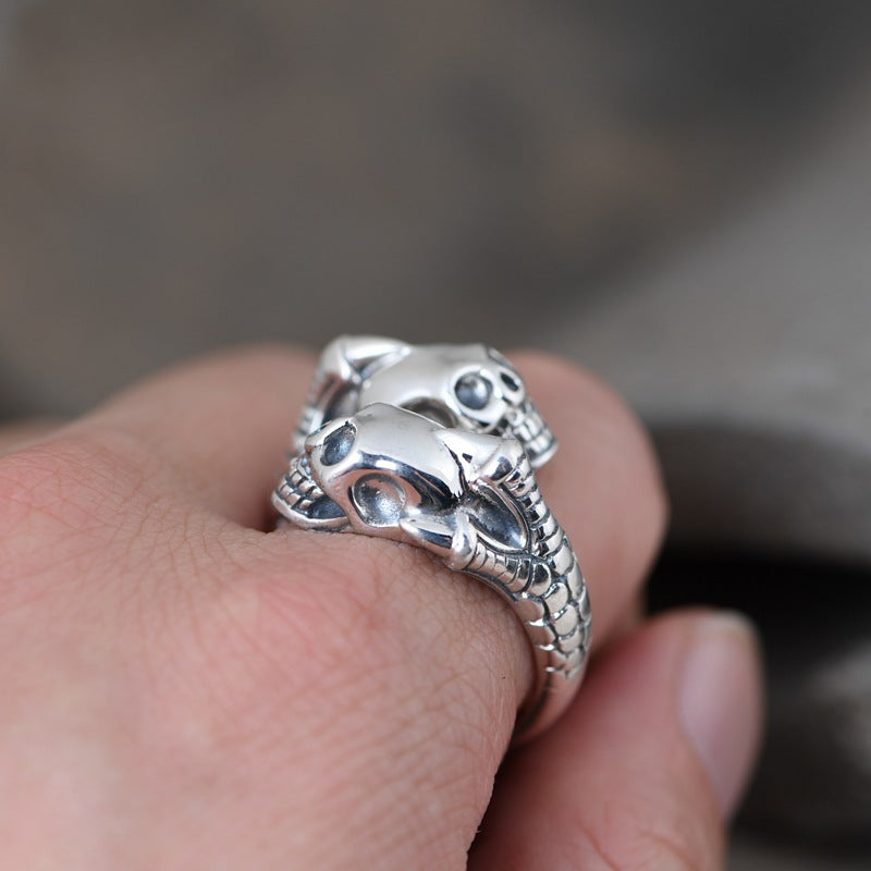 S925 silver double skull and claw ring worn on hand lifestyle shot demonstrating fit and scale