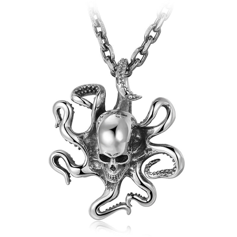 Front view of a sterling silver octopus skull pendant hanging from a chain, showing detailed tentacles and polished skull centerpiece.
