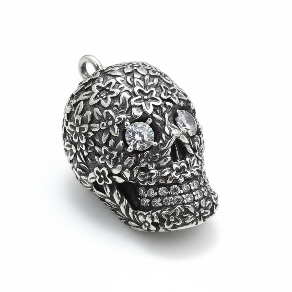 S925 sterling silver baroque skull pendant on white background showing intricate floral pattern, zircon accents and oxidized finish