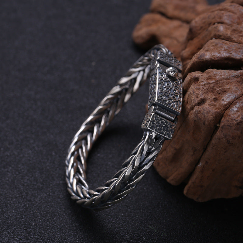 S925 sterling silver wheat chain bracelet showing intricate braided links, oxidized patina and substantial weight