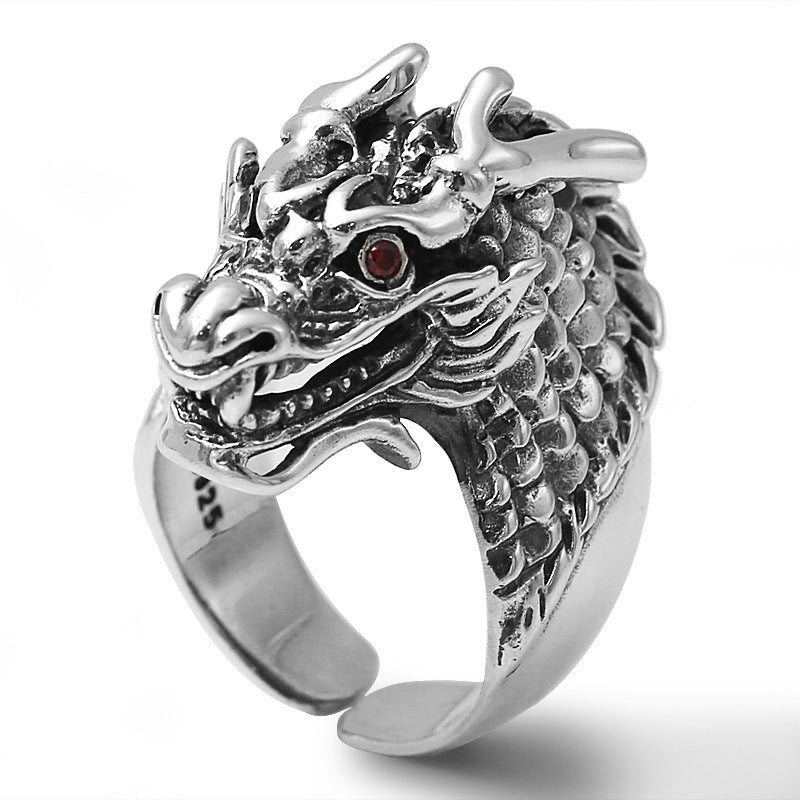 S925 sterling silver dragon ring on white background showing detailed scales, natural quartz eyes and oxidized finish