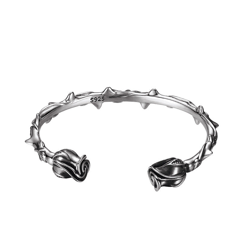 S925 sterling silver rose bracelet with vintage floral design and thorn details on white background