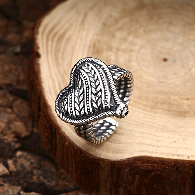 S925 sterling silver heart ring showing reverse side vine pattern and adjustable band construction