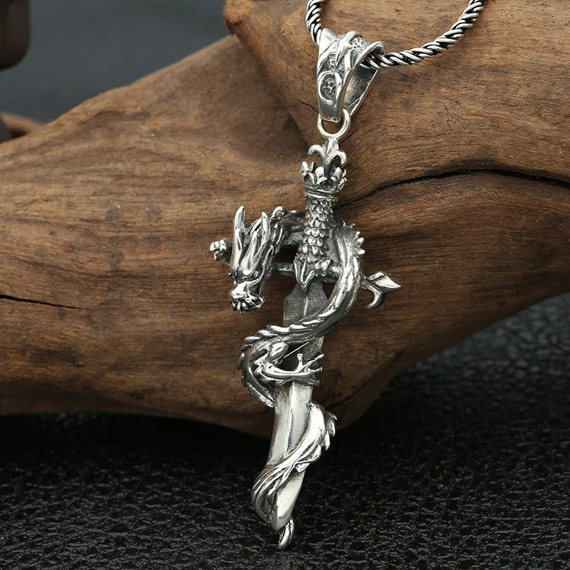 S925 sterling silver cross sword dragon pendant worn showing entwined dragon cross sword design and dimensional craftsmanship