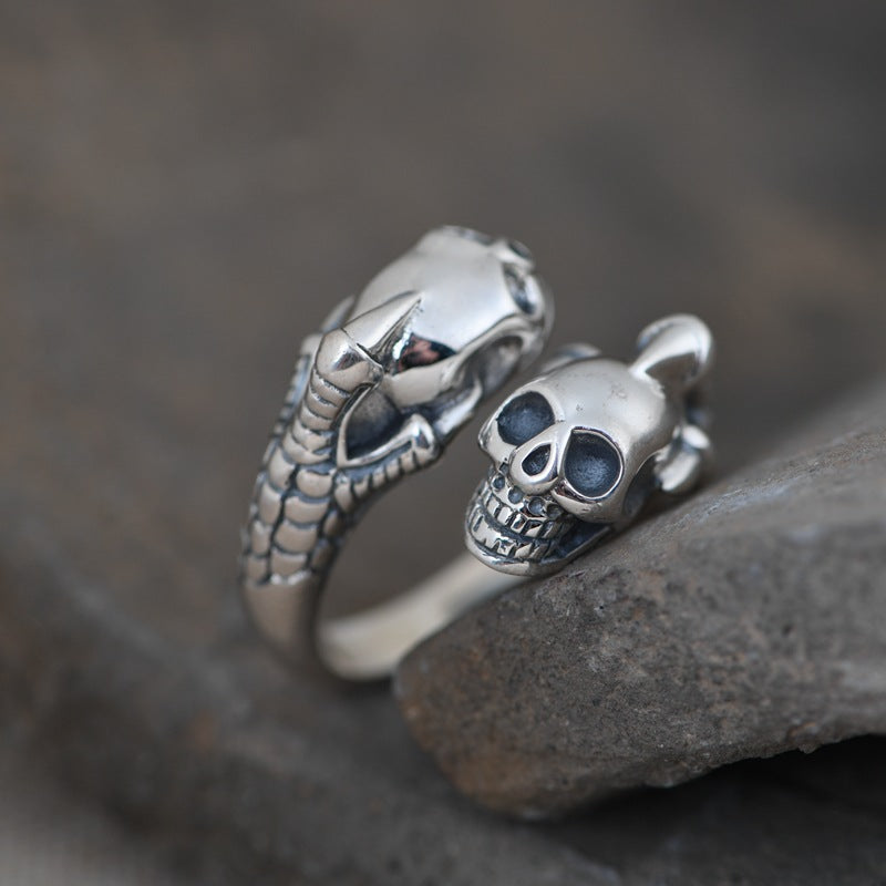 Sterling silver double skull claw ring profile view displaying adjustable open ring structure
