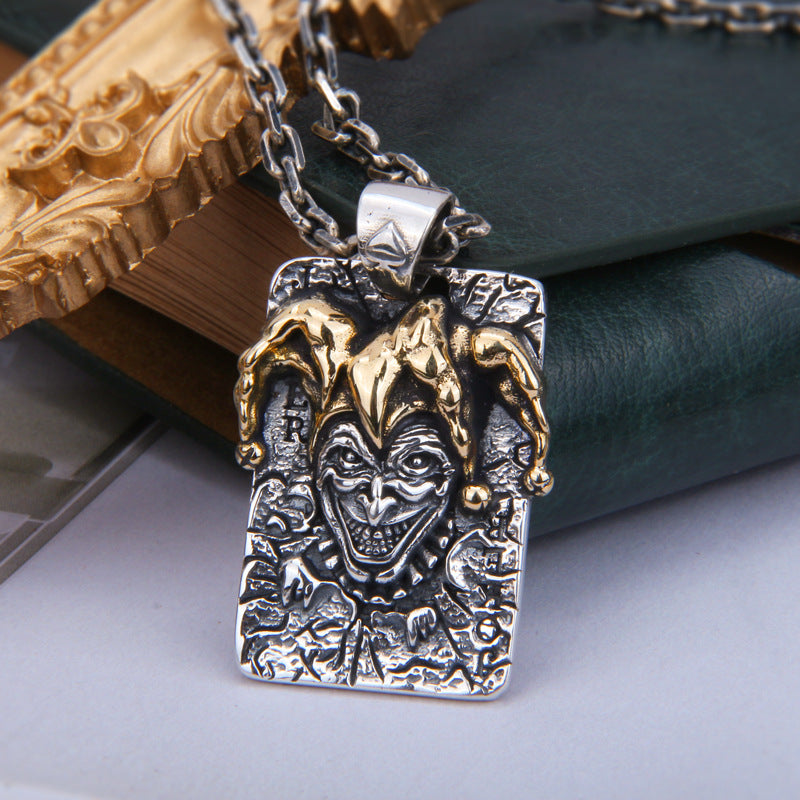 S925 sterling silver joker pendant on chain showing brass accents theatrical joker face detail and gothic craftsmanship