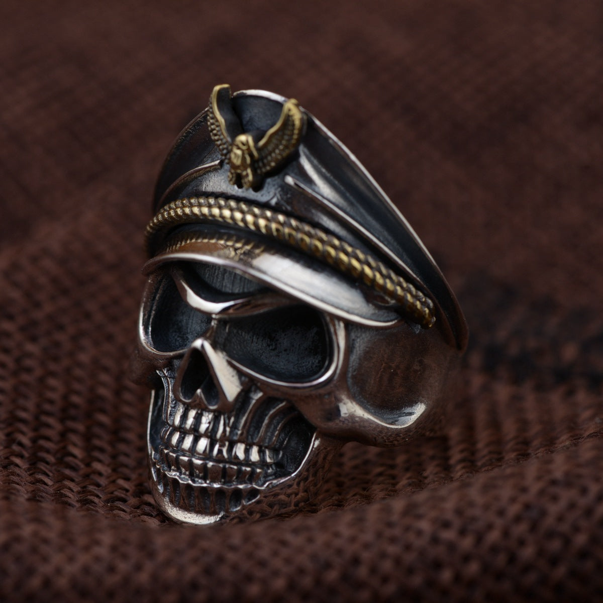 S925 sterling silver officer skull ring on wood showing gold eagle emblem military cap detail and commanding presence