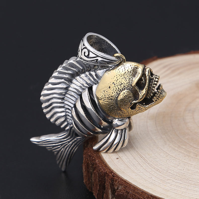 Front profile of S925 sterling silver piranha pendant on dark background showing predator charm and dimensional craftsmanship