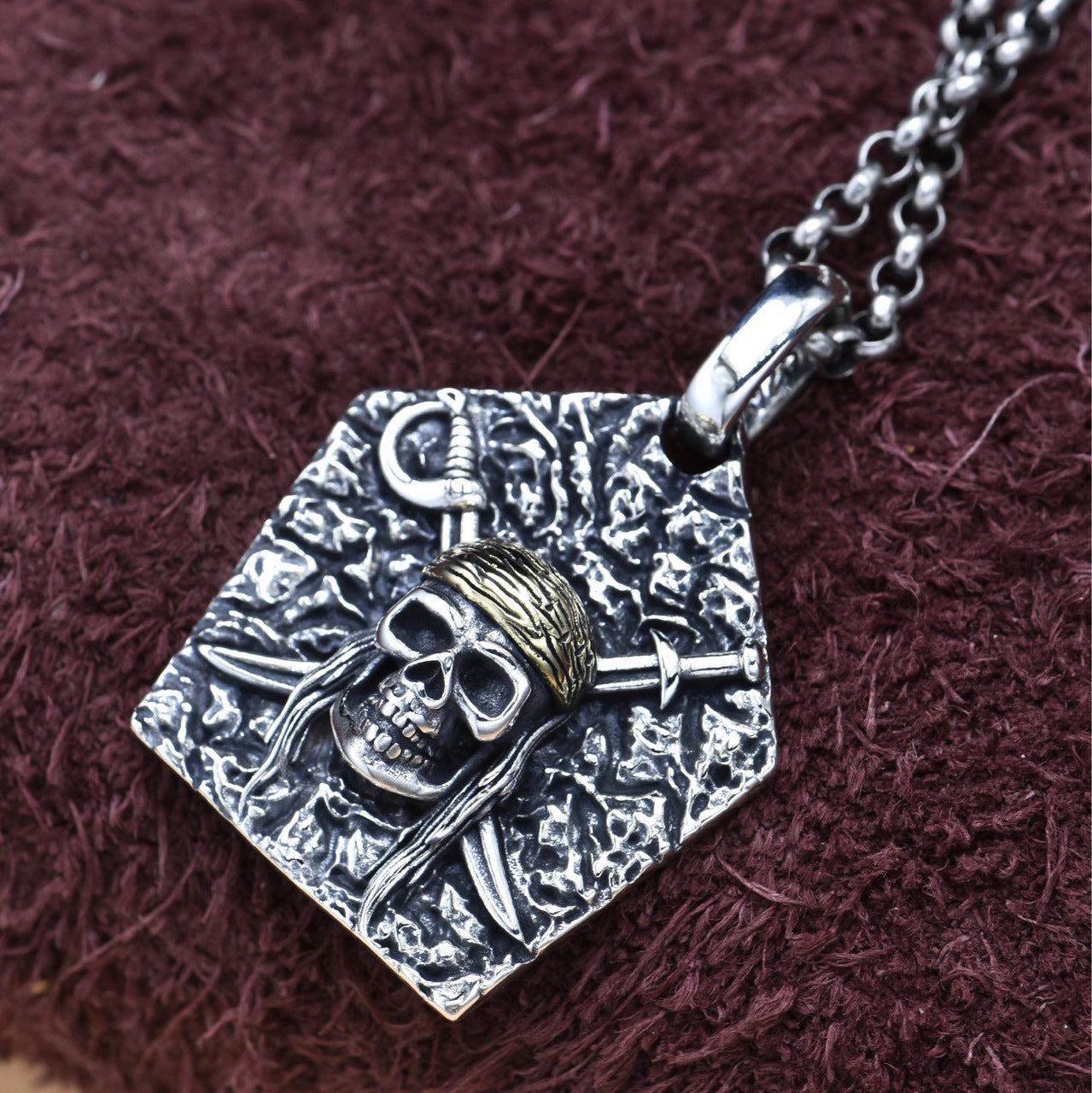 S925 sterling silver pirate skull pendant on chain showing intricate cutlass detail rebellious spirit and high seas symbolism