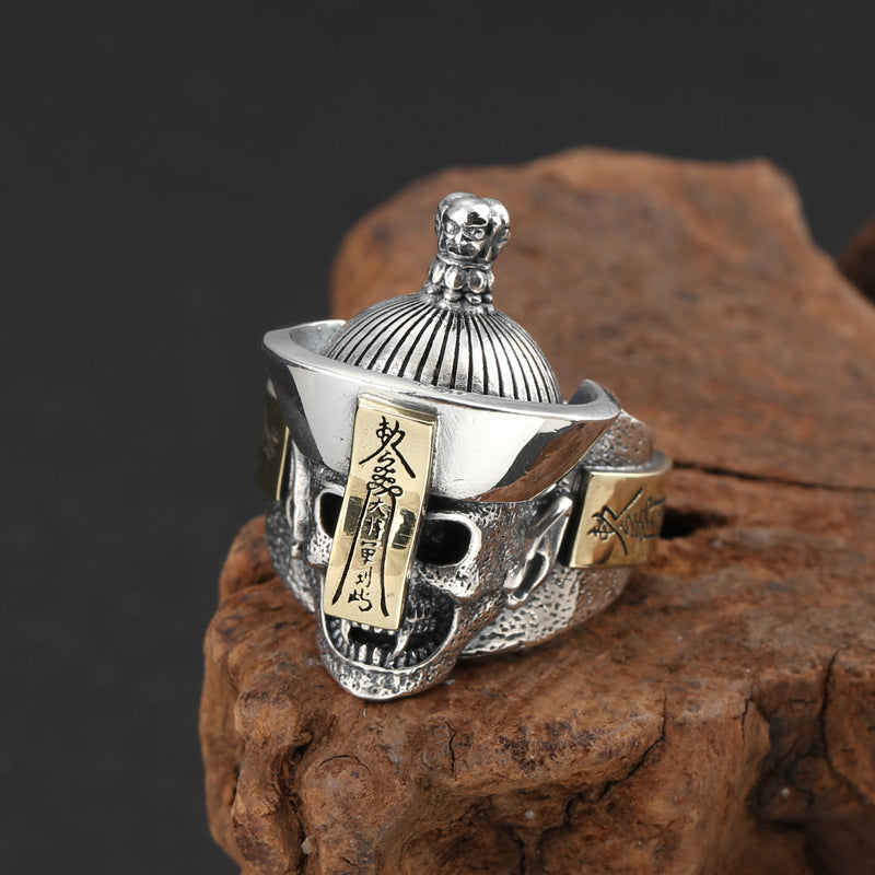 S925 sterling silver samurai skull ring on stone showing dimensional kabuto helmet brass plates and warrior design