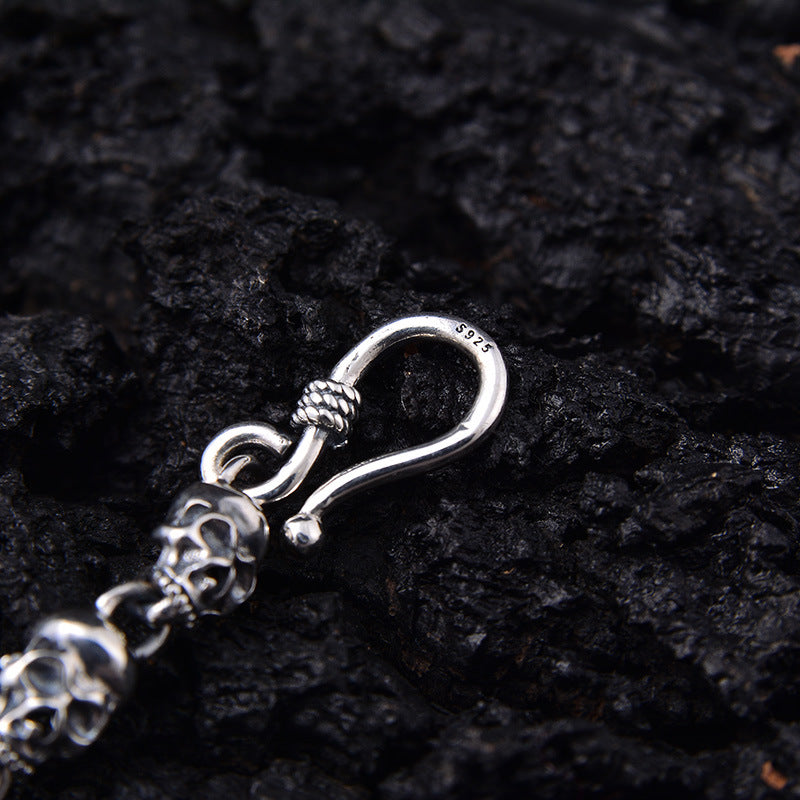 S925 sterling silver skull chain necklace S-hook clasp detail on dark background showing secure closure and craftsmanship