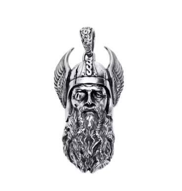 Close-up of a Viking warrior pendant featuring a long beard, winged helmet and intricate facial detailing.