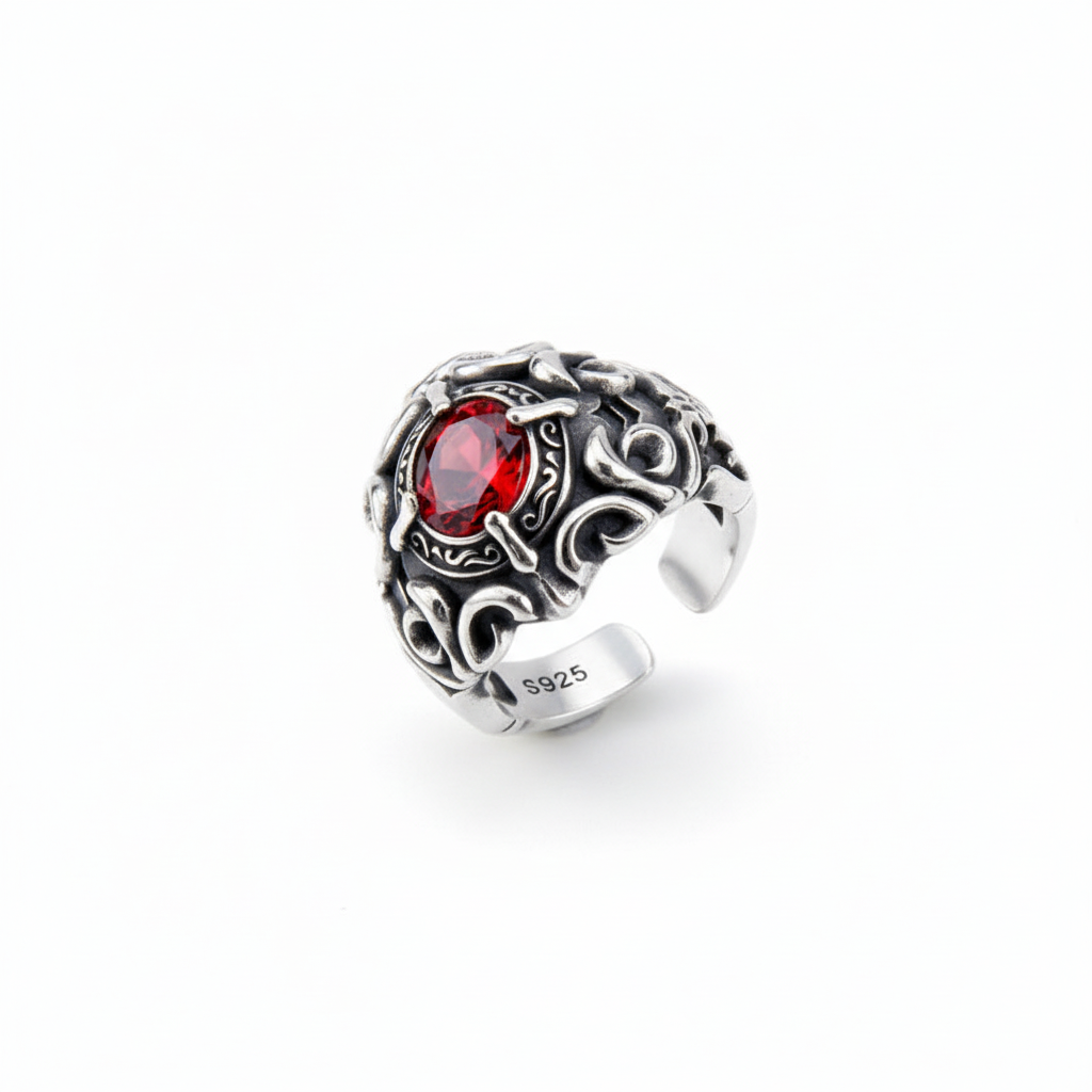 S925 sterling silver baroque scrollwork ring on white background showing intricate scrollwork patterns with red zircon centerpiece, oxidized finish, and natural shadow