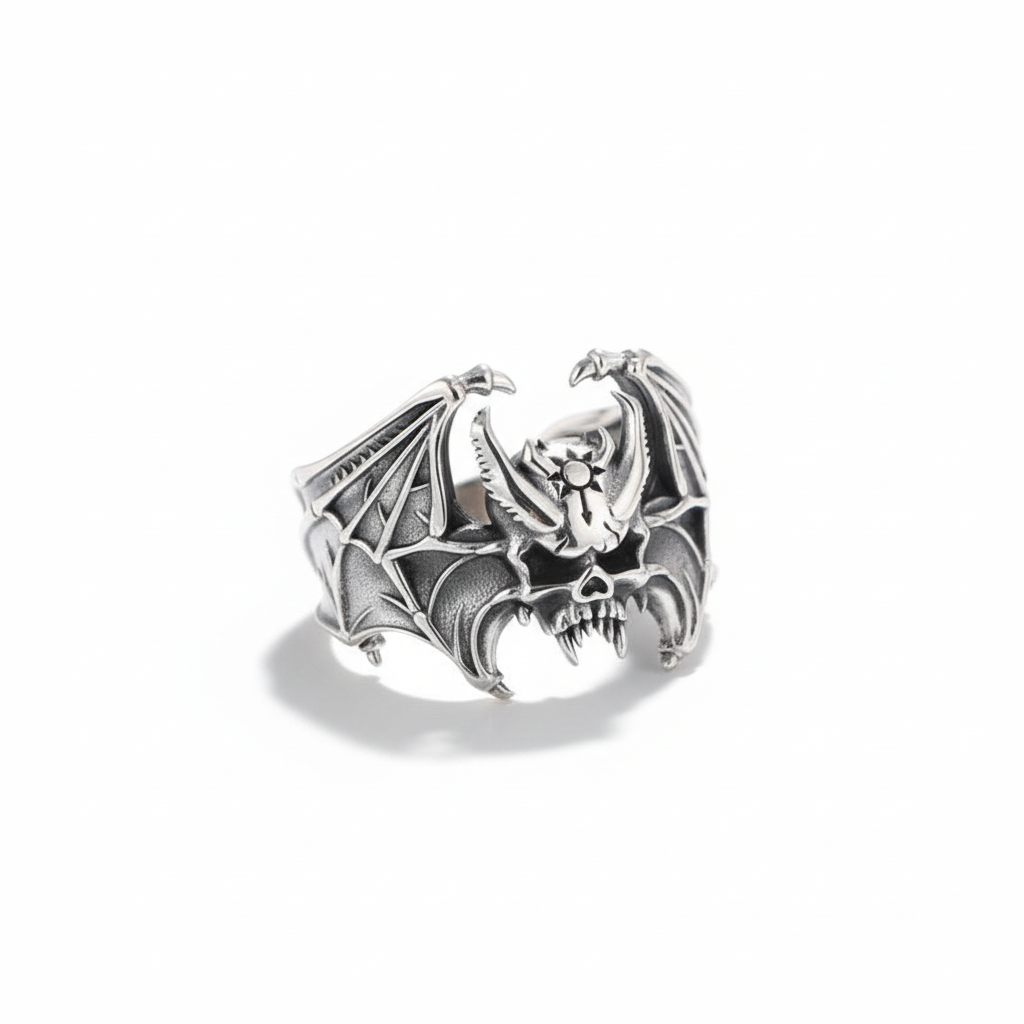 S925 sterling silver bat skull ring on white background showing Gothic wing design, adjustable band and oxidized finish