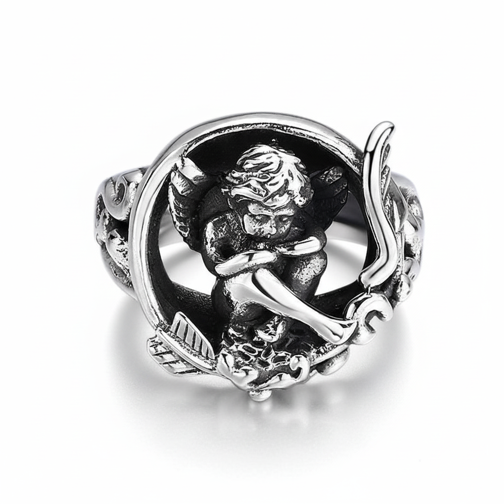 S925 sterling silver Cupid angel ring on white background showing adjustable statement ring with cherub angel design, black enamel accents, oxidized finish, and natural shadow