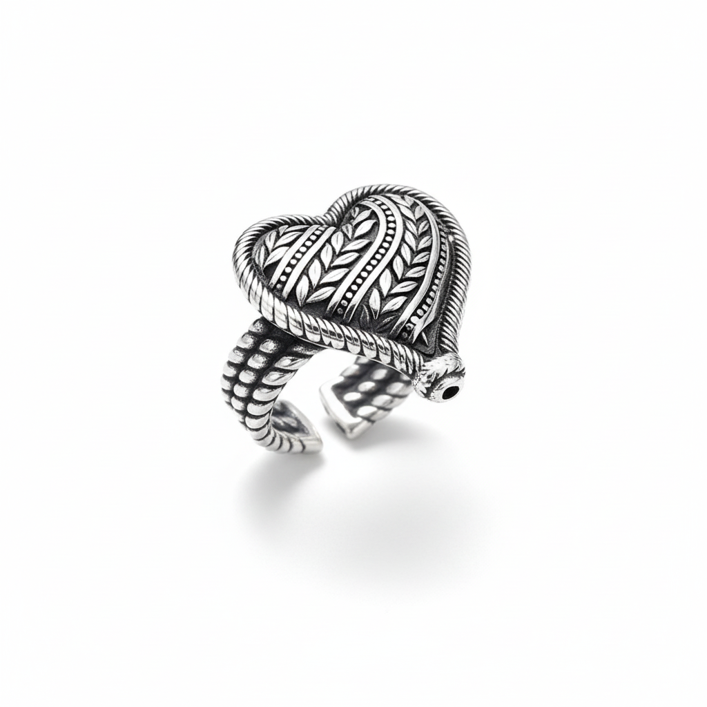 S925 sterling silver heart ring on white background showing adjustable band with heart design and vine pattern details, polished finish, and natural shadow